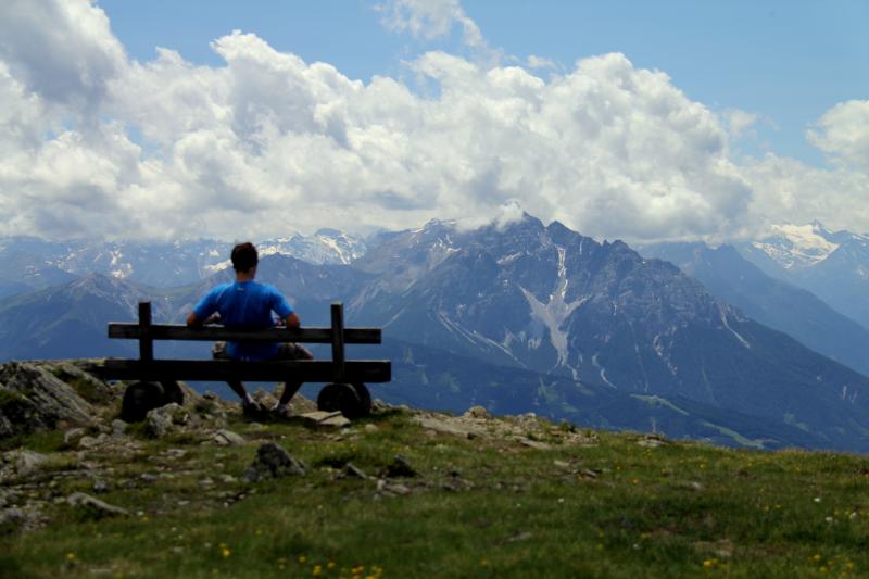 Picture of a man looking at the mountains